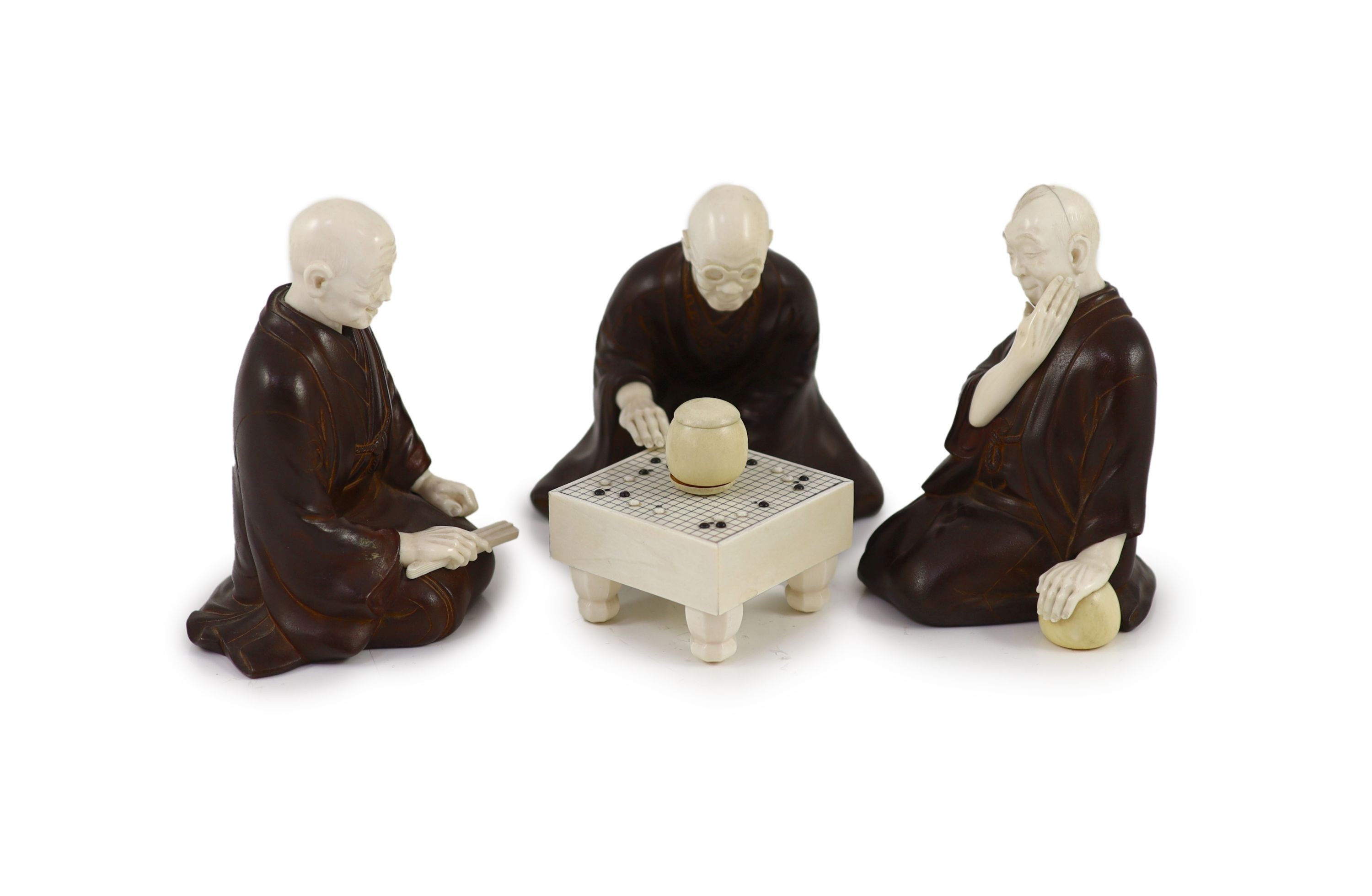 A set of three Japanese bronze and ivory okimono of ‘Go’ players, Meiji period,